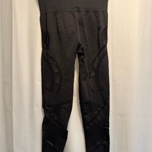 Black High-Waisted Leggings with laser cut outs on sides. Invisible scrunch butt